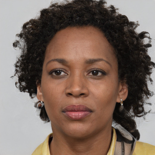 Neutral black adult female with short  brown hair and brown eyes