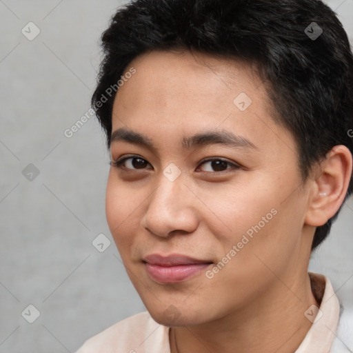 Joyful asian young-adult male with short  black hair and brown eyes