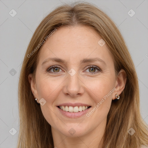 Joyful white adult female with long  brown hair and brown eyes