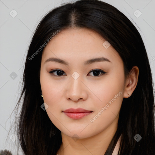 Joyful asian young-adult female with long  black hair and brown eyes