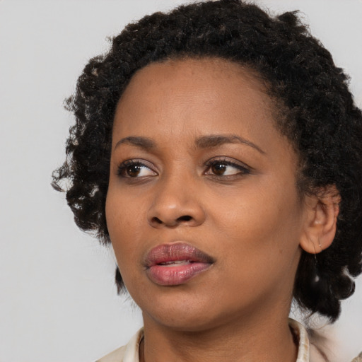 Neutral black young-adult female with medium  black hair and brown eyes