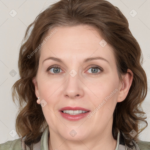 Joyful white adult female with medium  brown hair and grey eyes