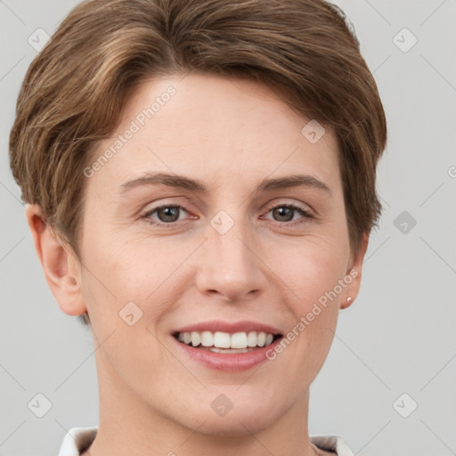 Joyful white young-adult female with short  brown hair and grey eyes