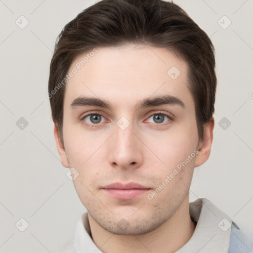 Neutral white young-adult male with short  brown hair and grey eyes