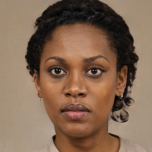 Neutral black young-adult female with medium  black hair and brown eyes