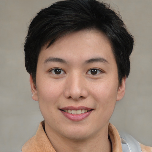 Joyful asian young-adult female with short  brown hair and brown eyes