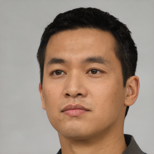 Neutral asian young-adult male with short  black hair and brown eyes