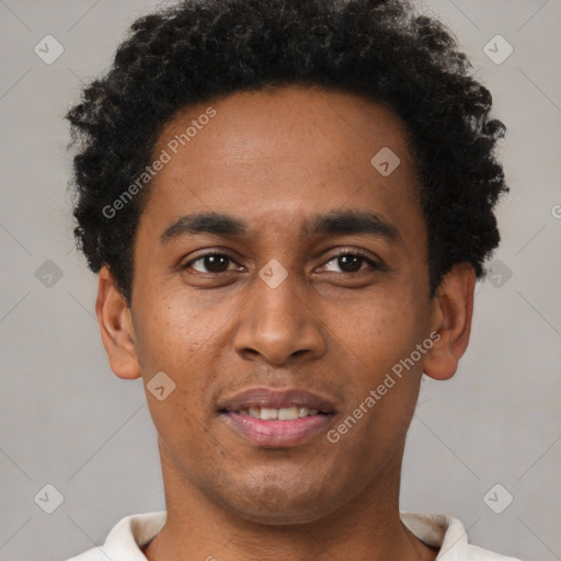 Joyful latino young-adult male with short  brown hair and brown eyes