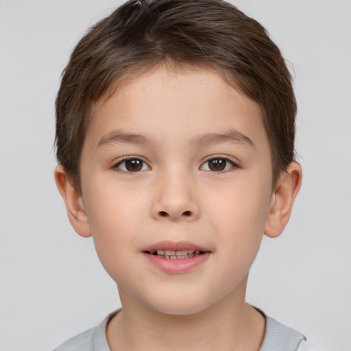 Joyful white child male with short  brown hair and brown eyes