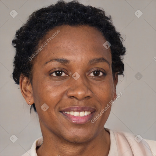 Joyful black adult female with short  brown hair and brown eyes