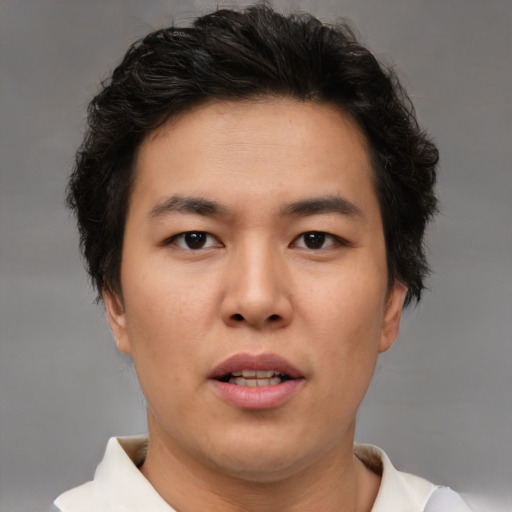 Neutral asian young-adult male with short  brown hair and brown eyes
