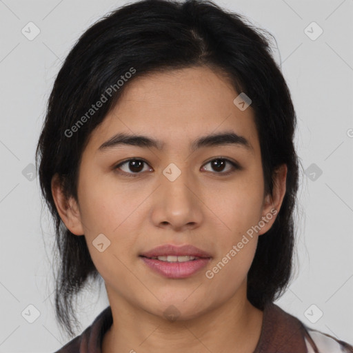 Joyful latino young-adult female with medium  brown hair and brown eyes