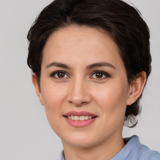 Joyful white young-adult female with medium  brown hair and brown eyes