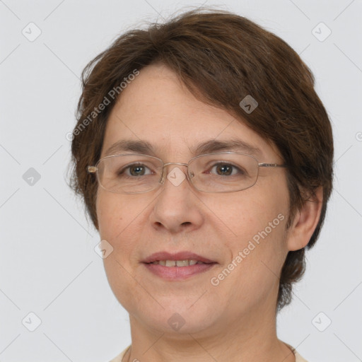 Joyful white adult female with short  brown hair and brown eyes