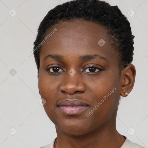 Joyful black young-adult female with short  black hair and brown eyes