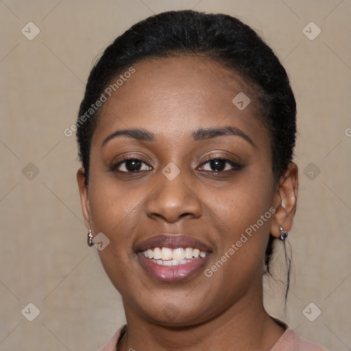 Joyful black young-adult female with short  black hair and brown eyes