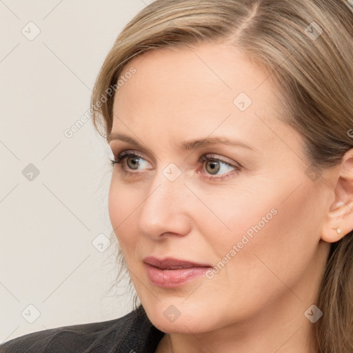 Joyful white young-adult female with long  brown hair and blue eyes