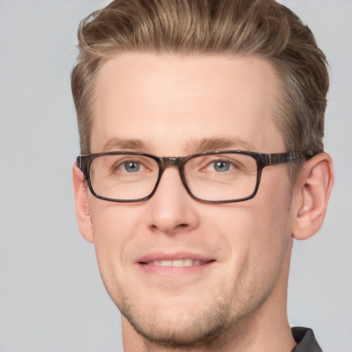 Joyful white adult male with short  brown hair and grey eyes