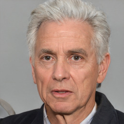 Neutral white middle-aged male with short  gray hair and brown eyes