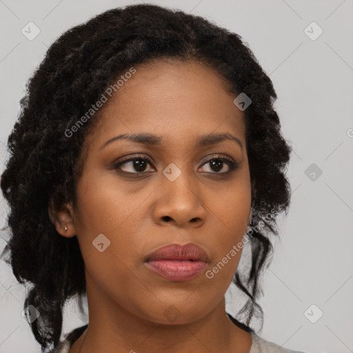 Neutral black young-adult female with medium  brown hair and brown eyes