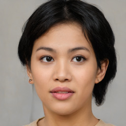 Joyful asian young-adult female with medium  black hair and brown eyes