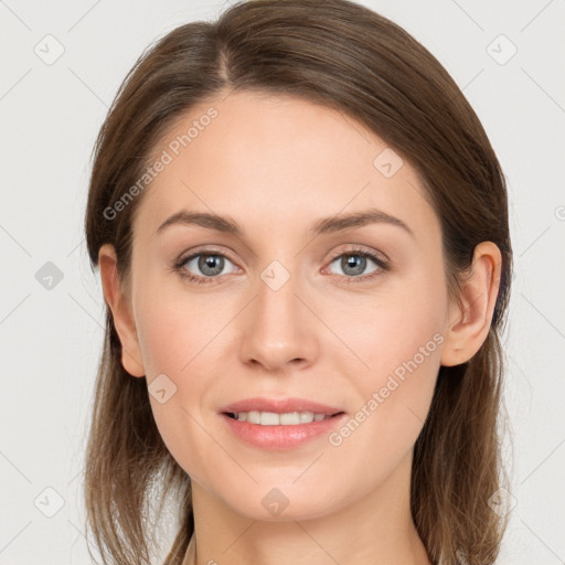 Joyful white young-adult female with long  brown hair and grey eyes