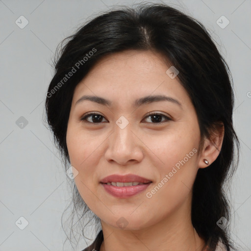 Joyful white adult female with medium  brown hair and brown eyes