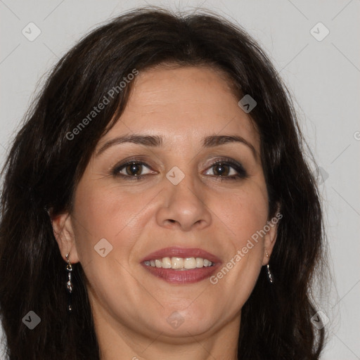 Joyful white adult female with long  brown hair and brown eyes