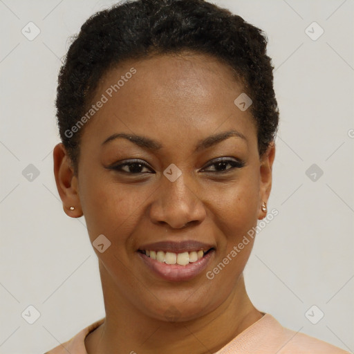 Joyful black young-adult female with short  brown hair and brown eyes