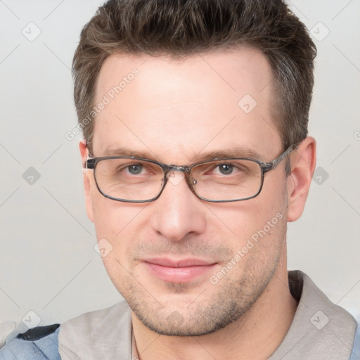 Joyful white adult male with short  brown hair and brown eyes