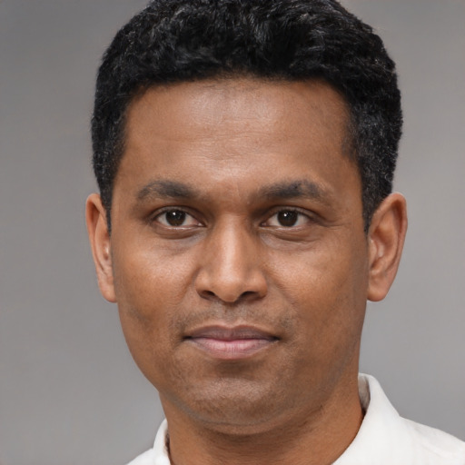 Neutral latino adult male with short  black hair and brown eyes