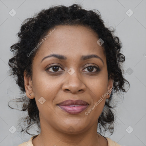 Joyful black adult female with medium  brown hair and brown eyes