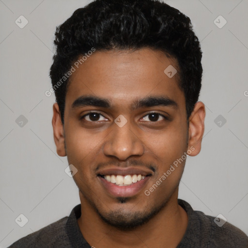 Joyful black young-adult male with short  black hair and brown eyes