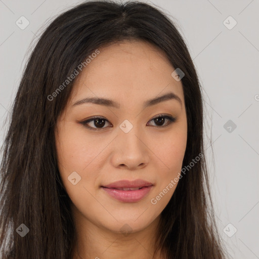 Joyful asian young-adult female with long  brown hair and brown eyes