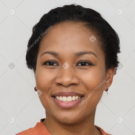 Joyful latino young-adult female with short  brown hair and brown eyes