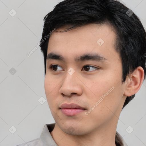 Neutral white young-adult male with short  black hair and brown eyes