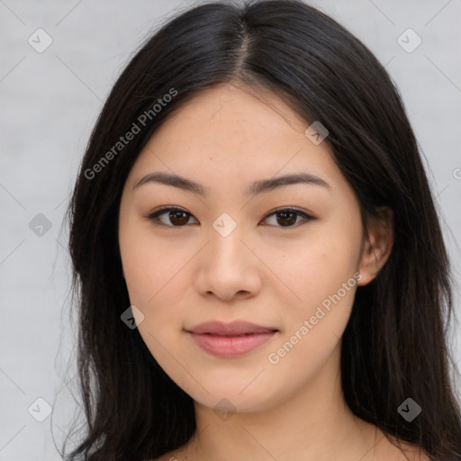 Joyful asian young-adult female with long  brown hair and brown eyes