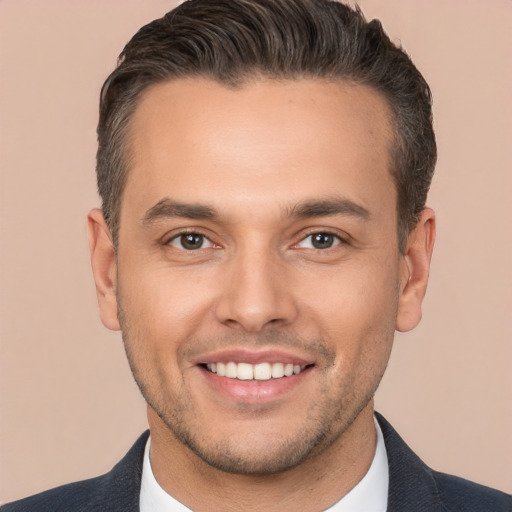 Joyful white young-adult male with short  brown hair and brown eyes