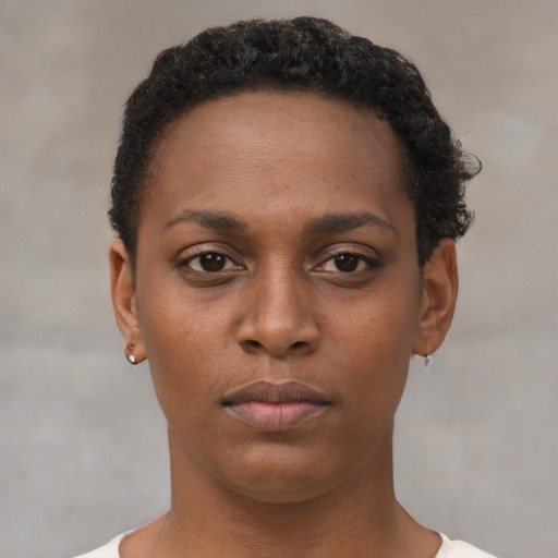 Neutral black young-adult female with short  brown hair and brown eyes