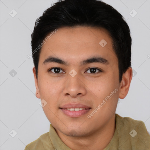 Joyful asian young-adult male with short  black hair and brown eyes