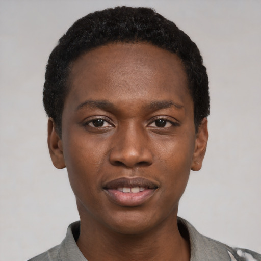 Joyful black young-adult male with short  black hair and brown eyes