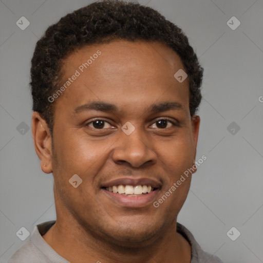 Joyful latino young-adult male with short  brown hair and brown eyes