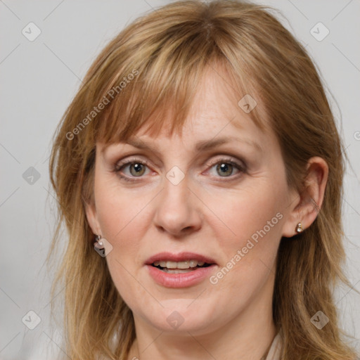 Joyful white adult female with medium  brown hair and grey eyes