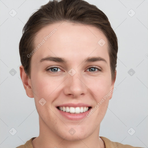 Joyful white young-adult female with short  brown hair and grey eyes