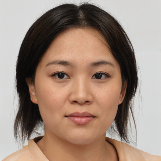 Neutral asian young-adult female with medium  brown hair and brown eyes