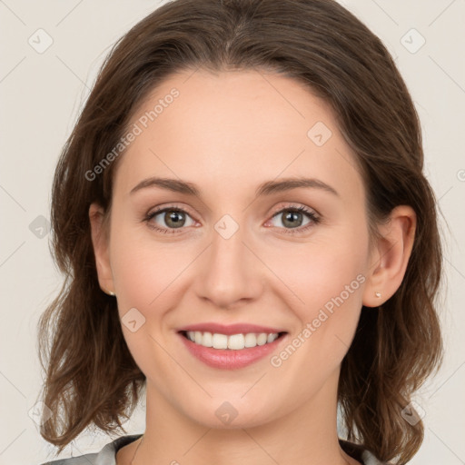 Joyful white young-adult female with medium  brown hair and green eyes