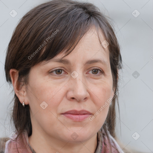 Joyful white adult female with medium  brown hair and grey eyes