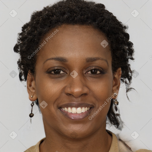 Joyful black young-adult female with short  brown hair and brown eyes