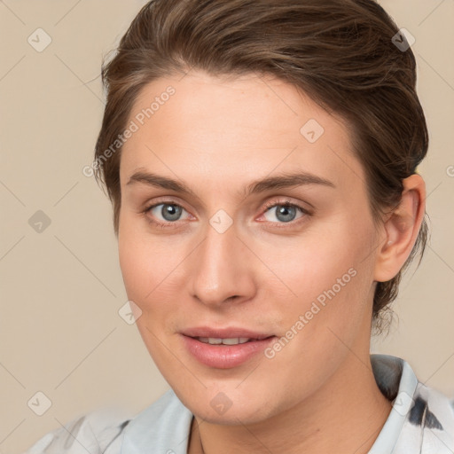 Joyful white young-adult female with medium  brown hair and grey eyes