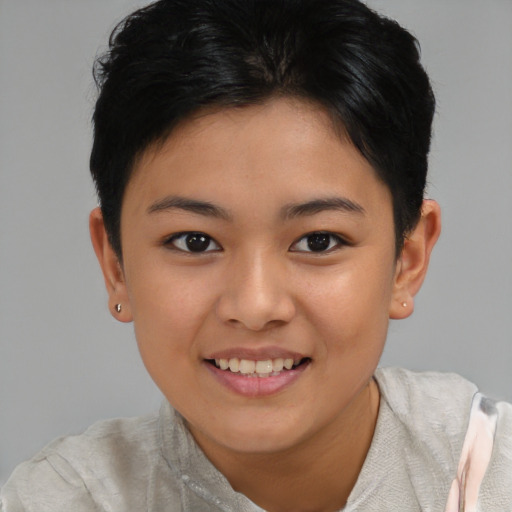 Joyful asian child female with short  brown hair and brown eyes